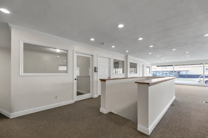 Showroom with stairs leading to the bsmt