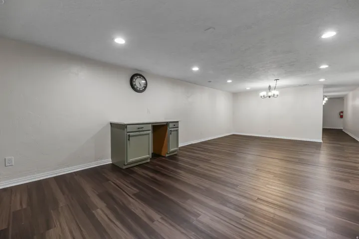 Kitchen / Break Room featuring ample cabinet and countertop space, sink, dishwasher and stove. Located in the bsmt of the North Bldg
