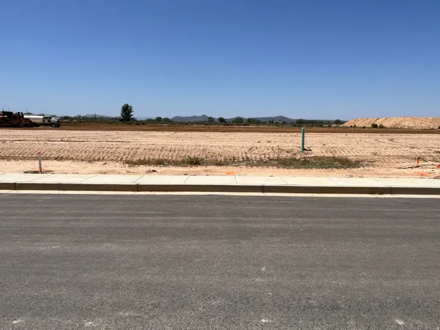 Expansive graded lot with existing curb and sidewalk infrastructure