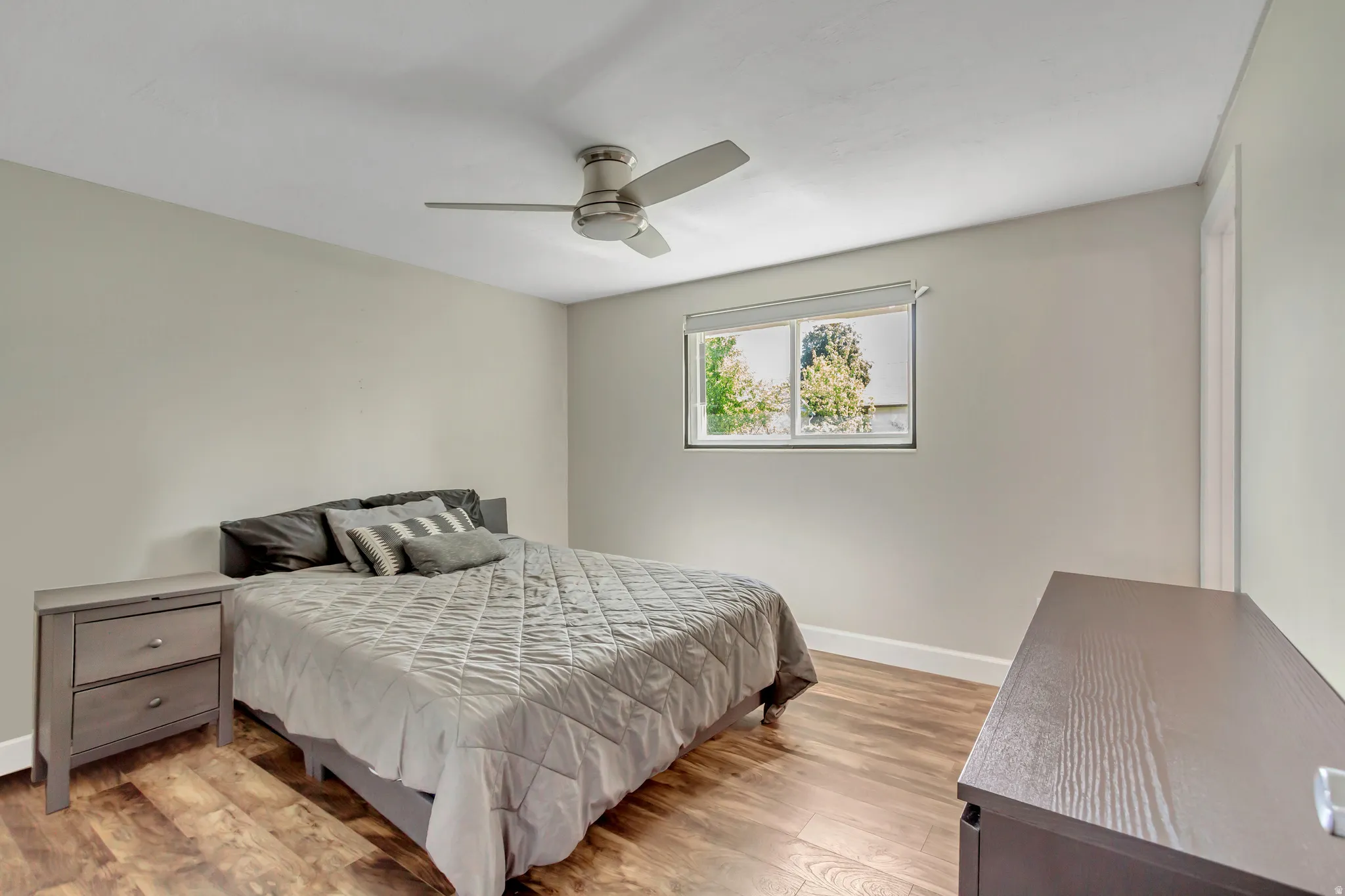 Neutral wall tones with wood-finish flooring