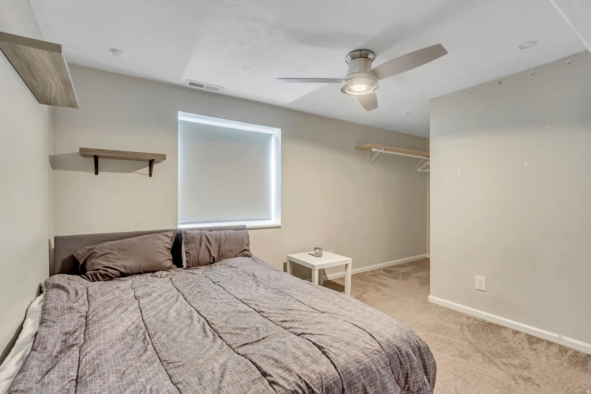 Room featuring recessed lighting, a modern ceiling fan, and light-toned carpeting
