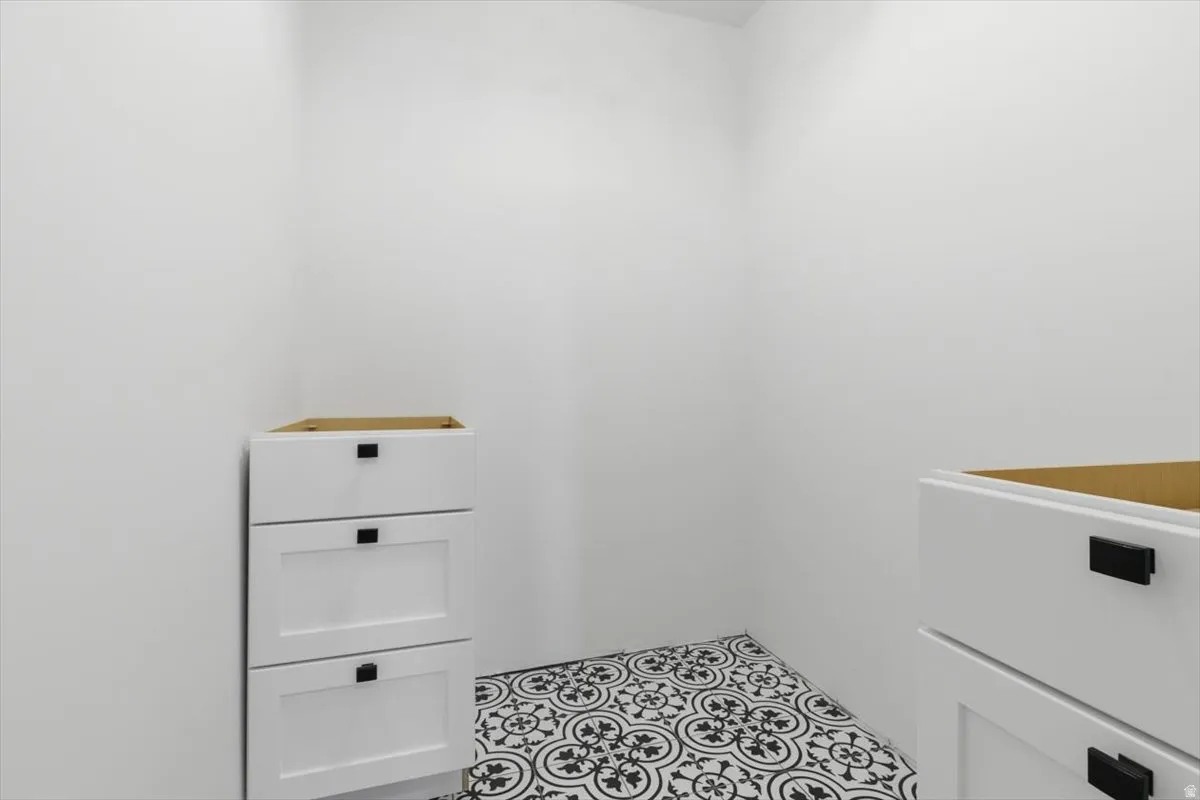 White walls complementing patterned floor tiles