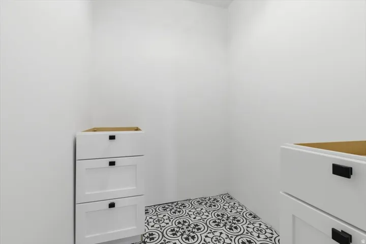 White walls complementing patterned floor tiles