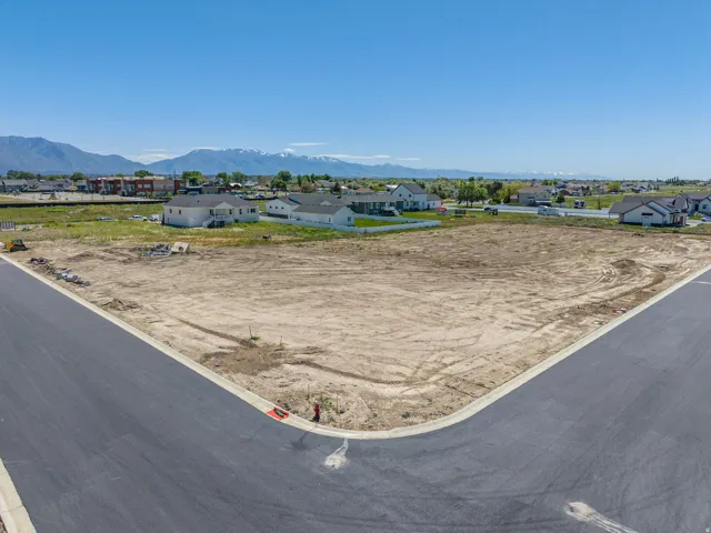 Expansive corner lot featuring a level, cleared building site