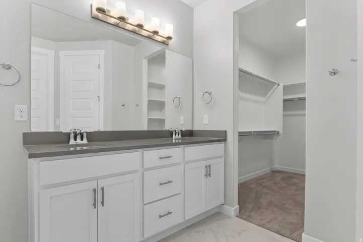 Dual vanity with under-mount sinks and grey countertops