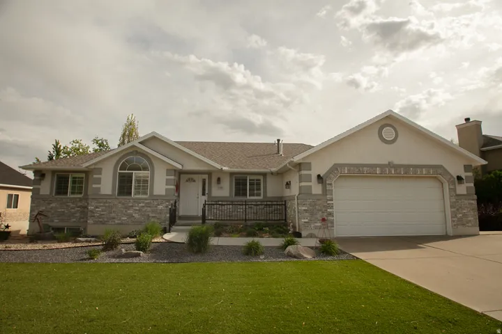 Stucco exterior with stone veneer accents