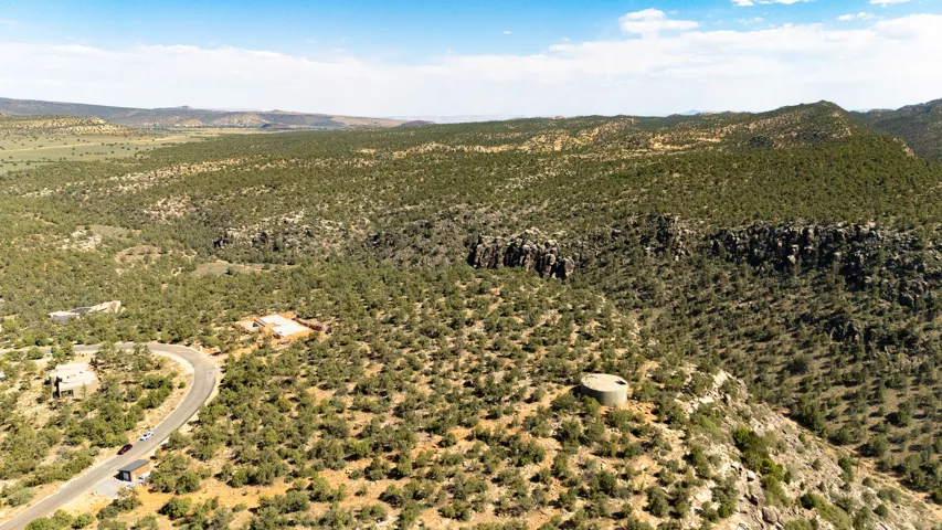 Expansive natural landscape featuring a winding paved road