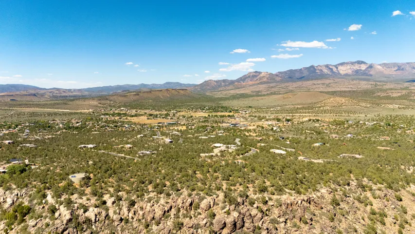 Expansive desert landscape featuring numerous properties nestled among natural foliage
