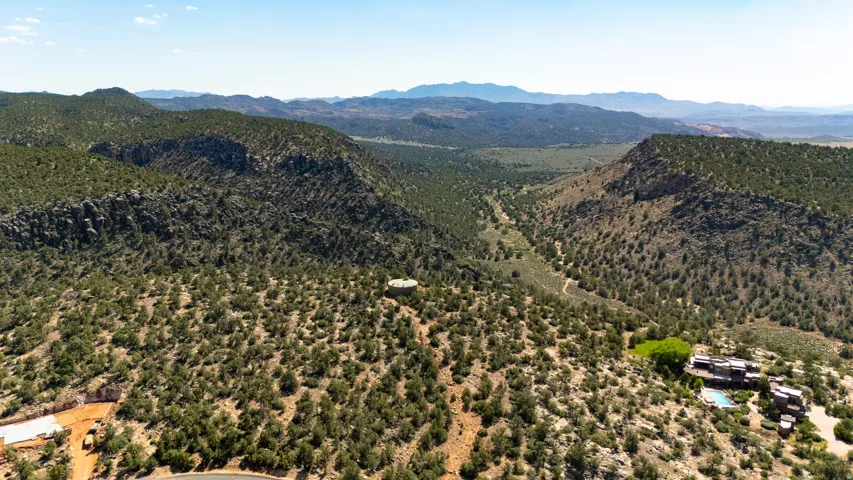 Expansive acreage featuring rugged terrain and distant mountain ranges