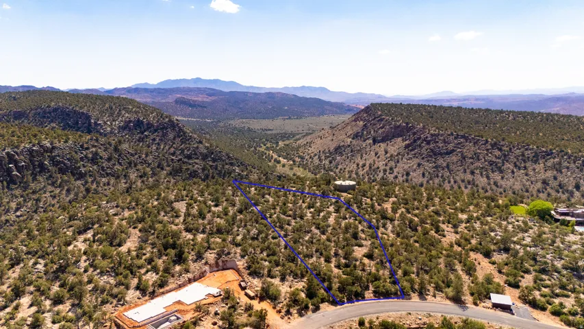 Terraced hillside lot with natural desert landscaping