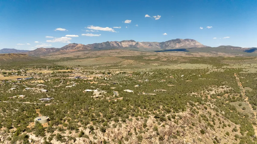 Expansive desert landscape with mountainous backdrop