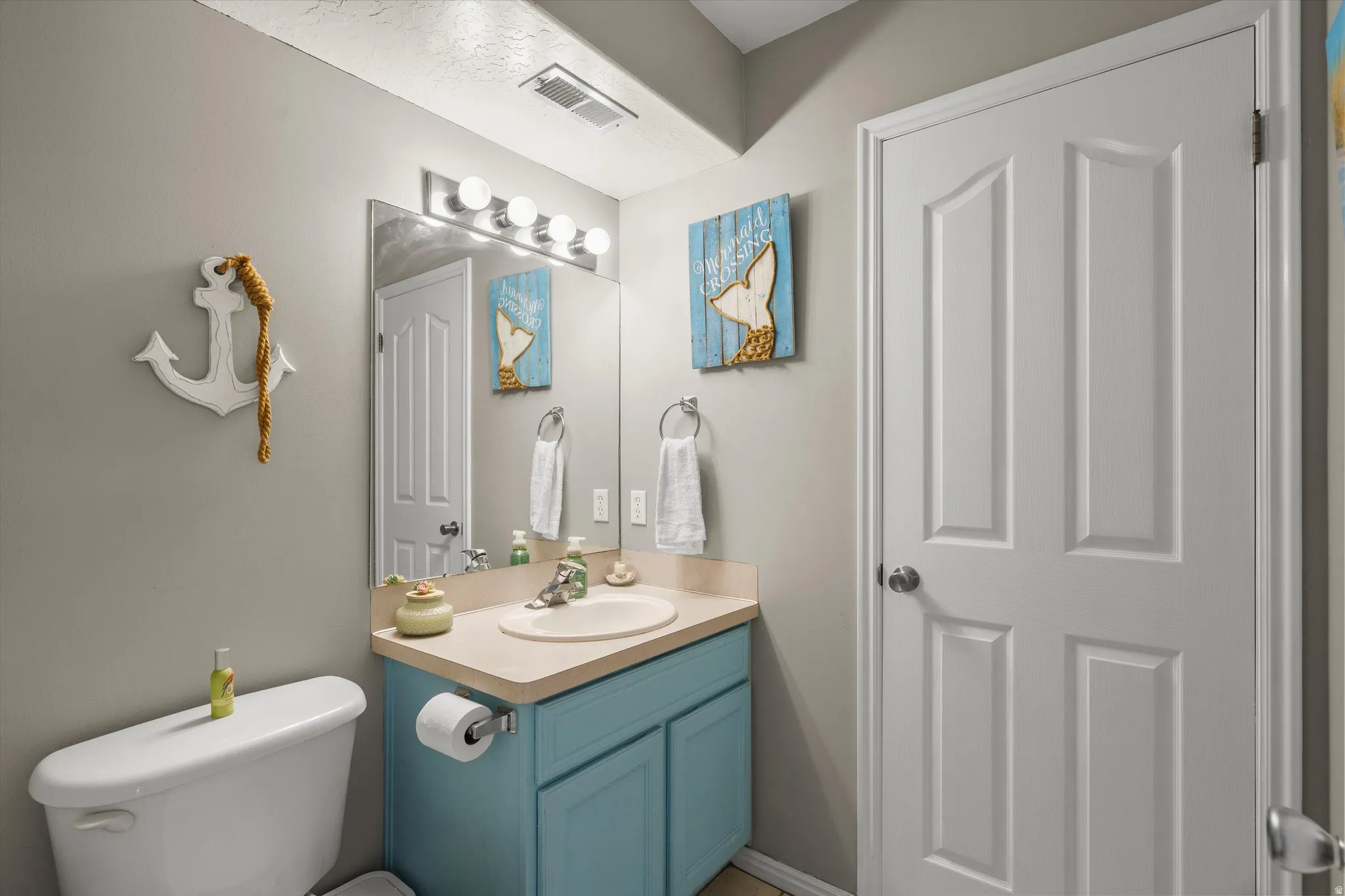Half bathroom featuring oversized linen/storage closet
