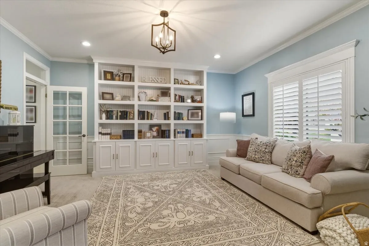 Built-in white cabinetry with open shelving and lower storage cabinets