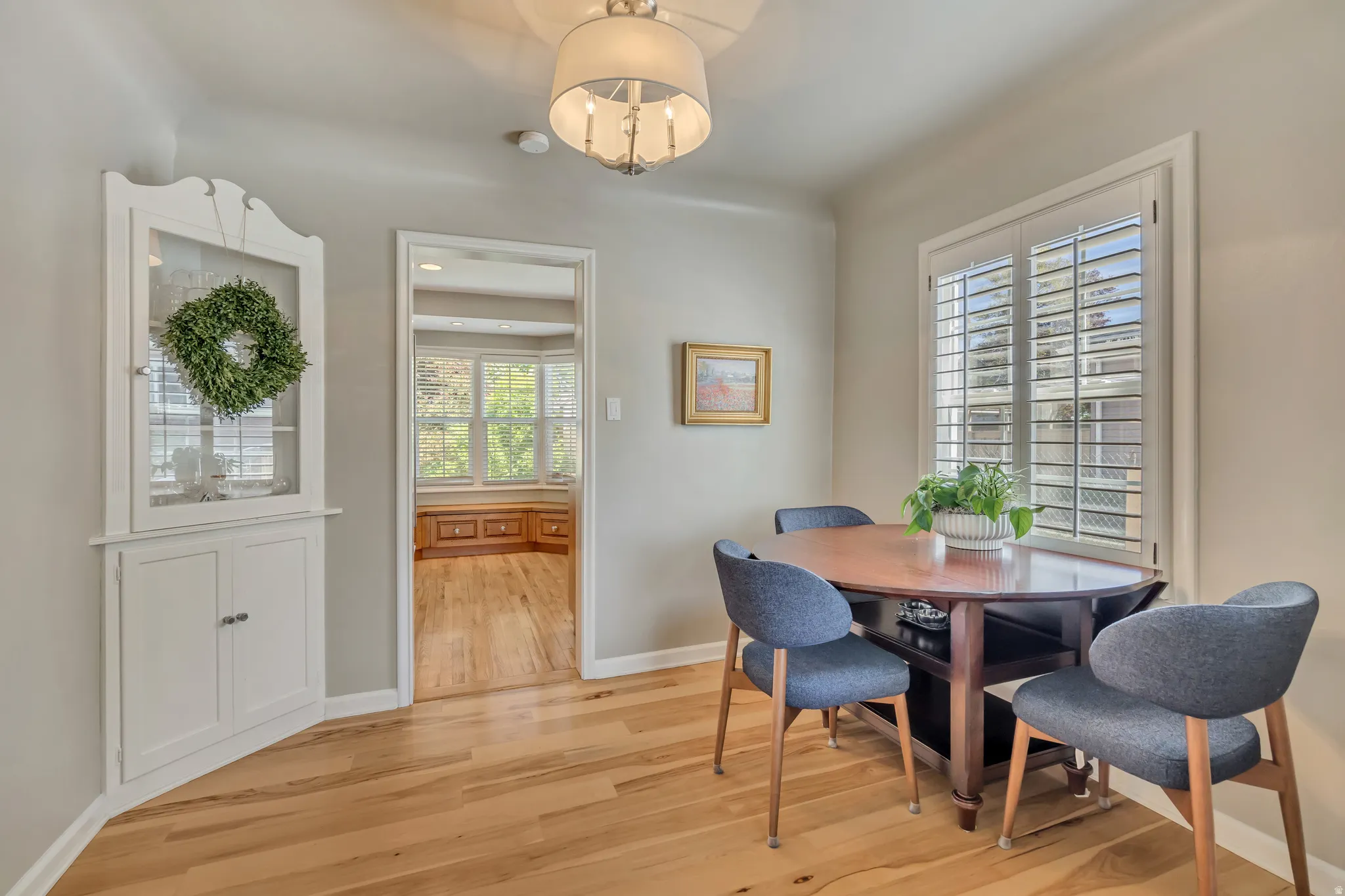 Light wood-finish flooring complements the neutral wall tones