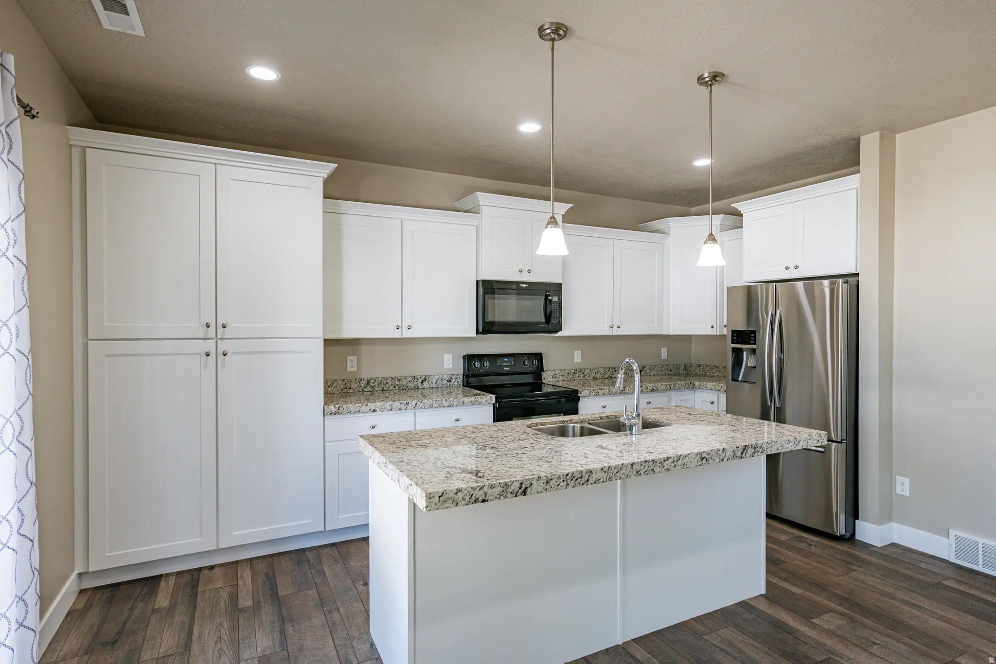 Upgraded soft-close kitchen cabinetry.