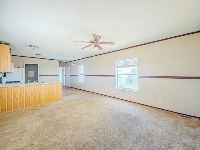 Open concept living area featuring a neutral color palette