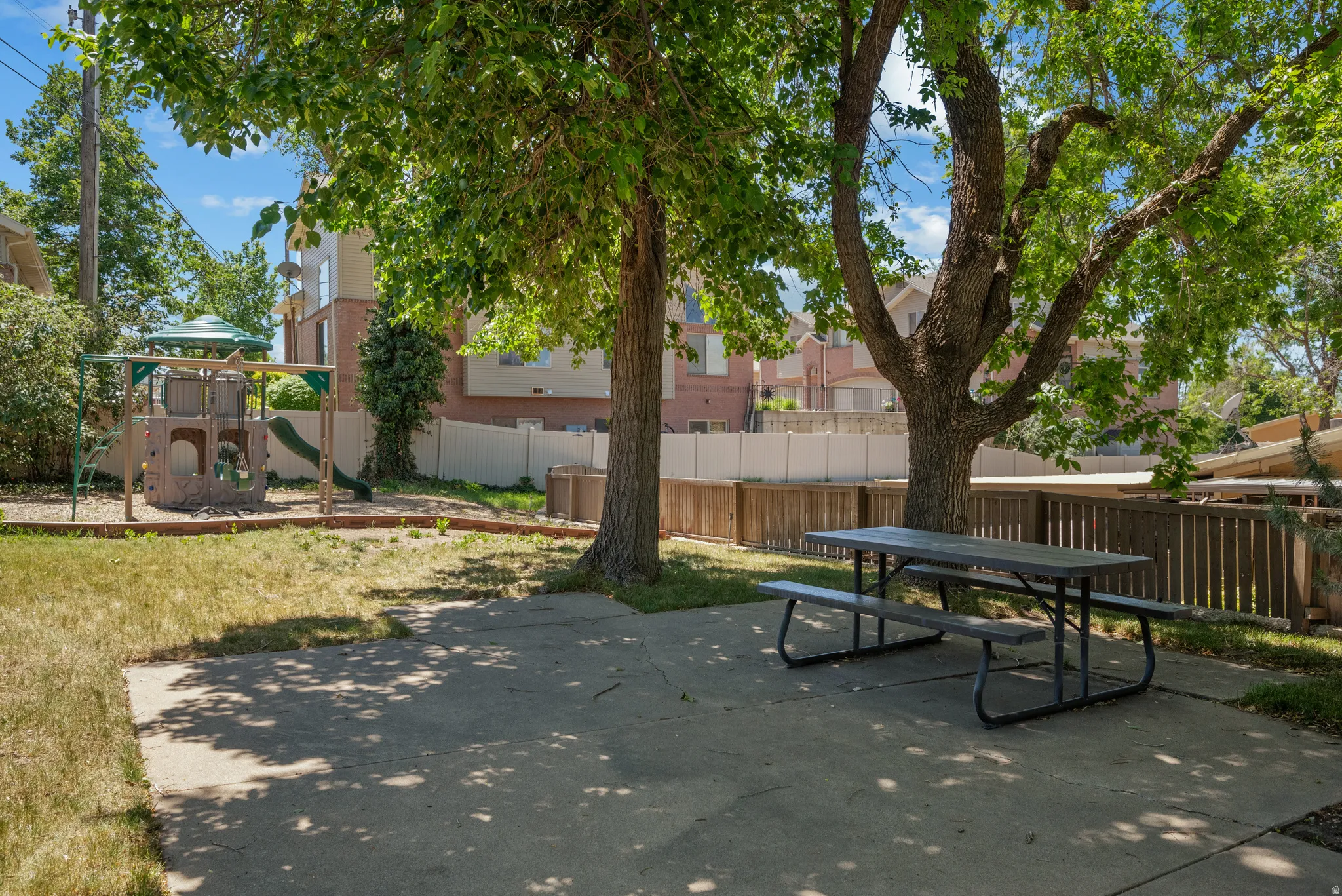 Picnic area with mature shade trees and community playground