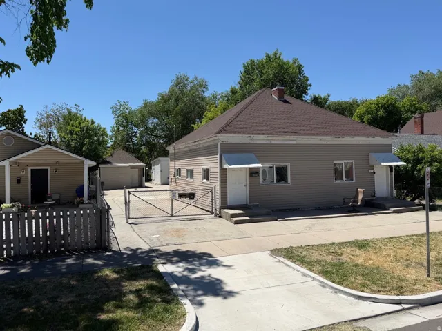 Property street view. Driveway is gated.