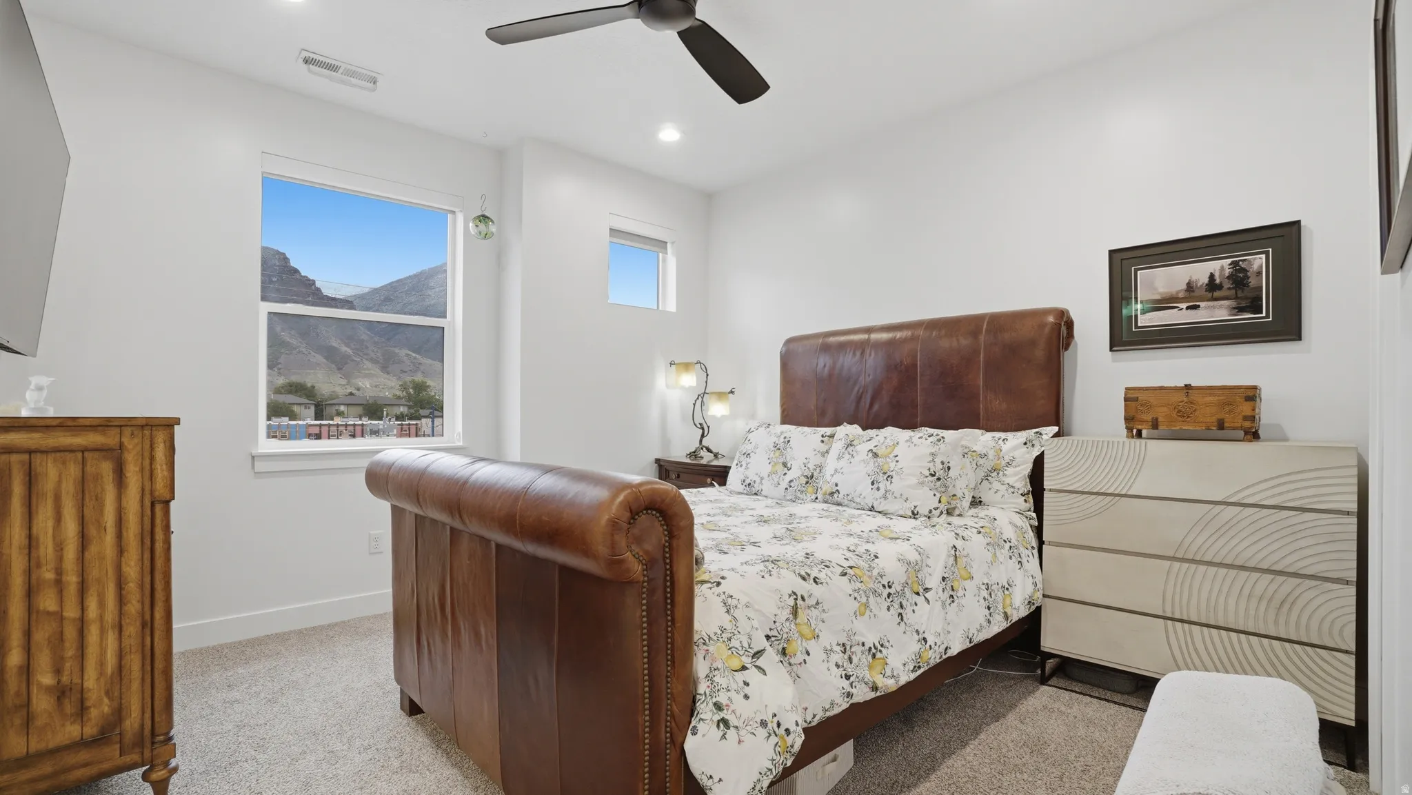 Bedroom featuring neutral-toned carpeting, recessed lighting, and a ceiling fan