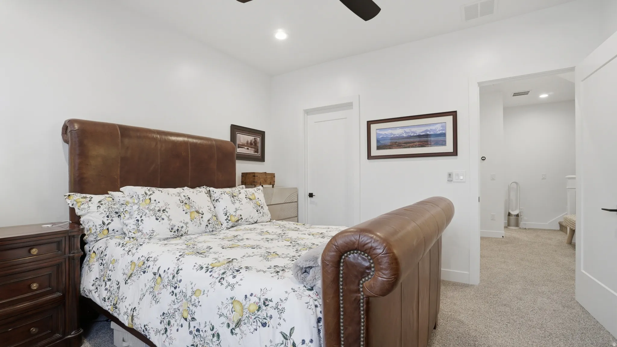 Carpeted bedroom featuring white walls, recessed lighting, and a ceiling fan