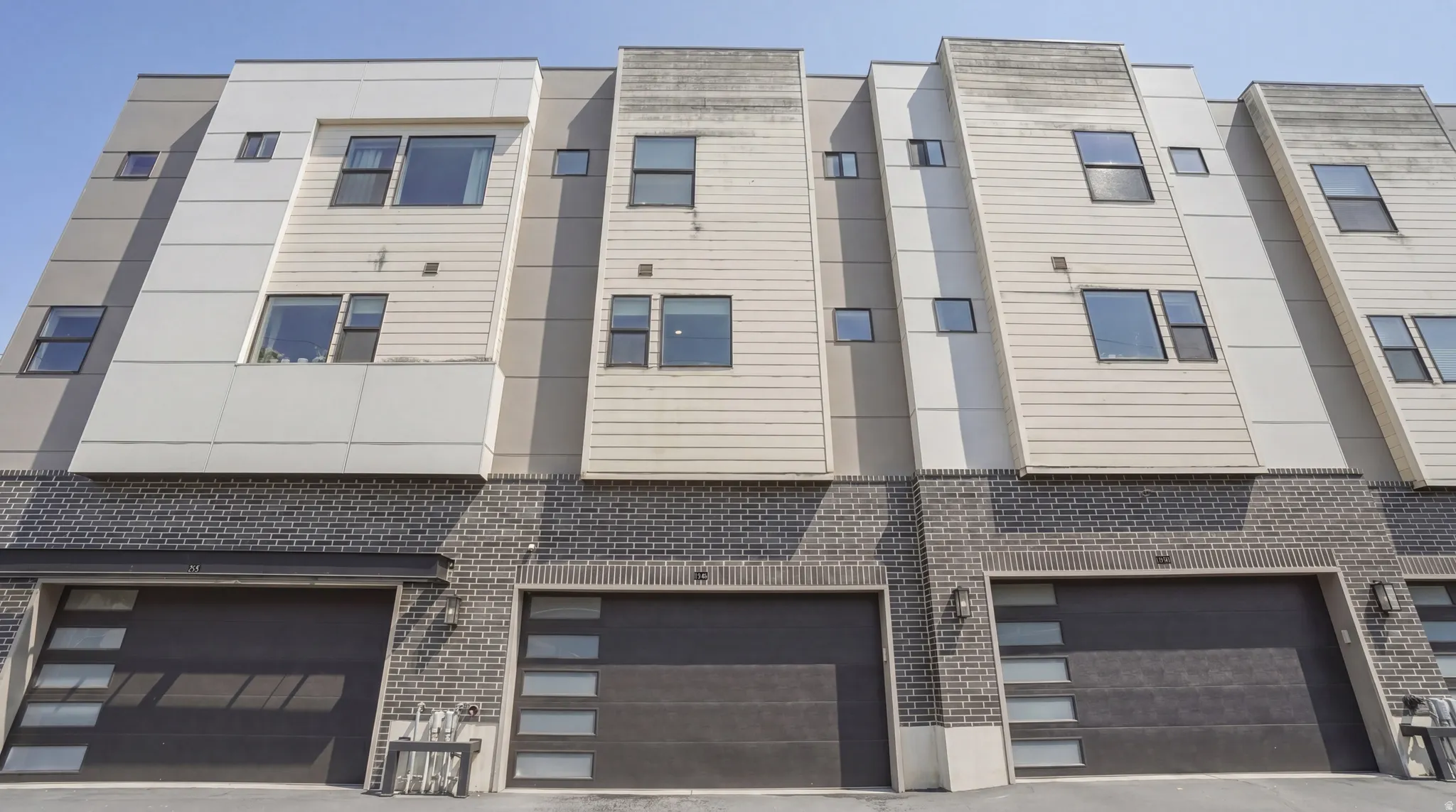 Contemporary townhome exterior featuring multi-level architecture