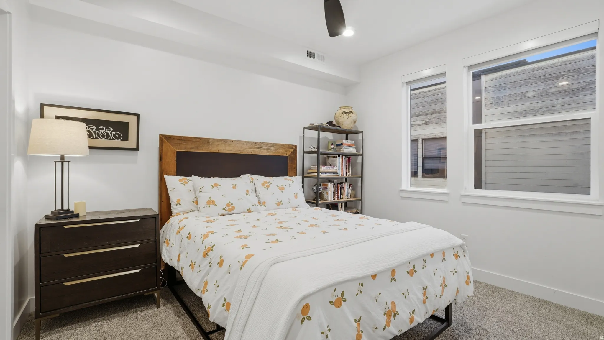 Bedroom featuring a wood-panel headboard, recessed lighting, and a ceiling fan