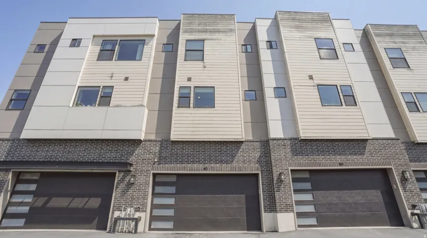 Contemporary townhome exterior featuring multi-level architecture