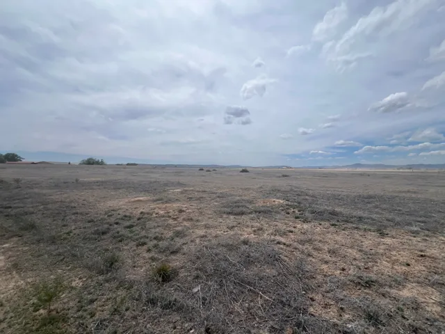 Expansive open land featuring a natural, arid landscape
