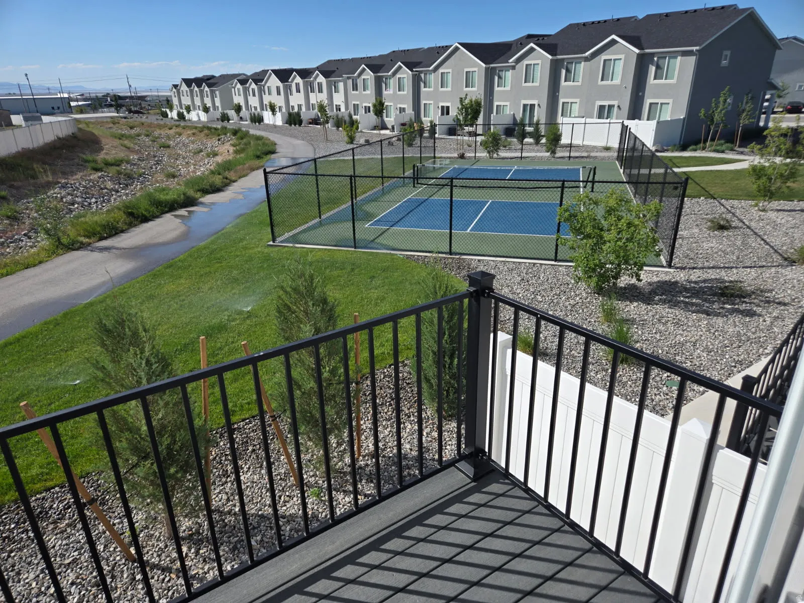 Balcony view of Walkway and Pickleball Court.