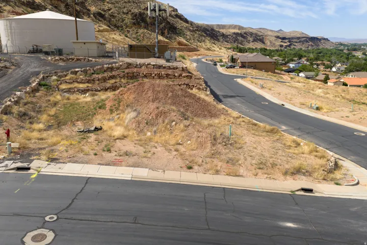 Paved road frontage with defined curb and gutter