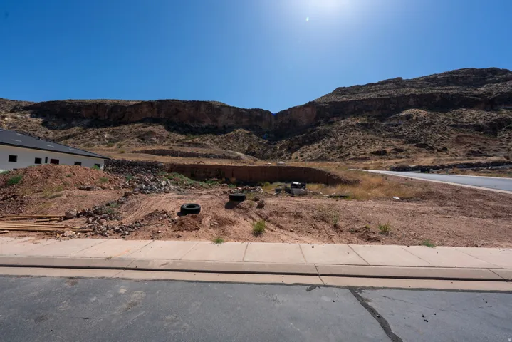 Expansive land parcel featuring desert landscaping and a distant mountain backdrop