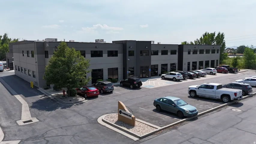 Modern commercial building featuring a gray and black facade