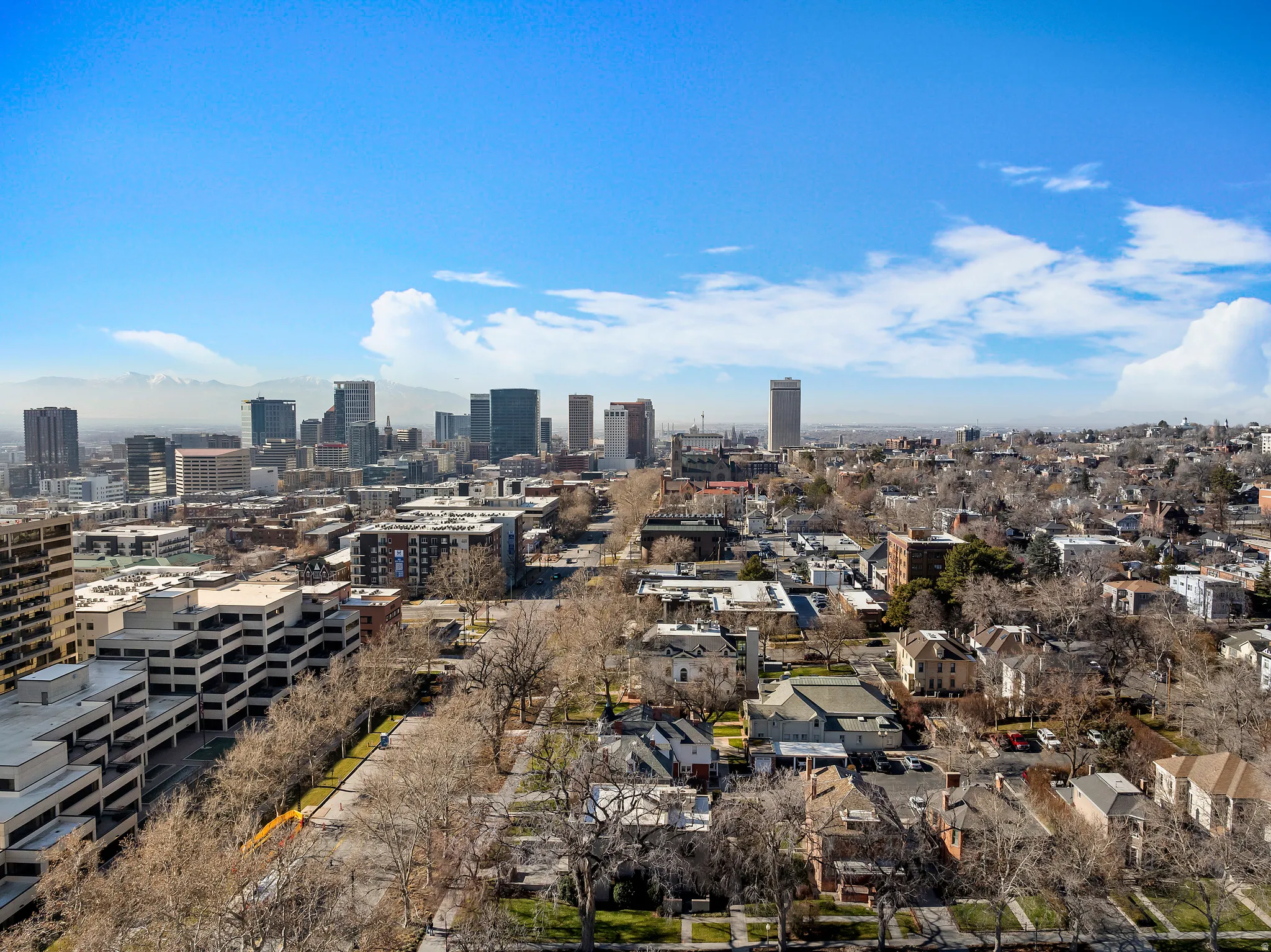 Expansive cityscape with a distant mountain range backdrop