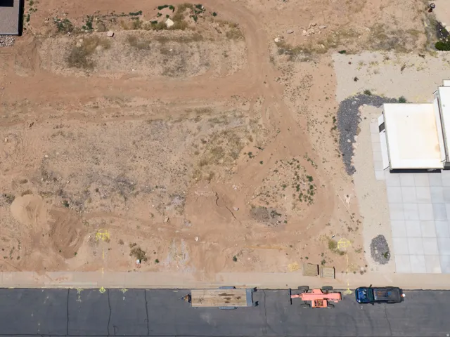 Expansive parcel featuring a large, undeveloped lot with visible ground markings