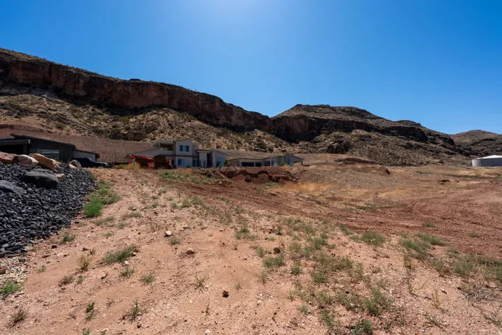 Property situated on a desert landscape with dramatic mountain backdrops