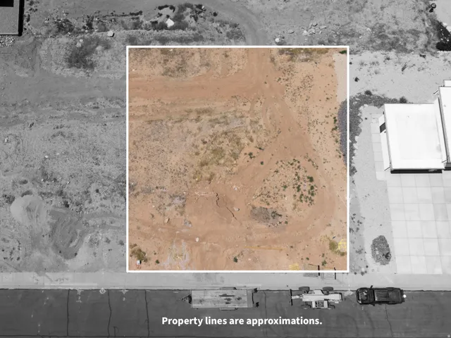 Expansive undeveloped parcel featuring varied terrain and sparse natural vegetation