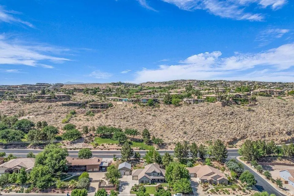 Aerial perspective showcasing multiple properties nestled into a desert landscape