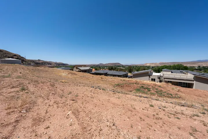Expansive sloped lot with natural terrain