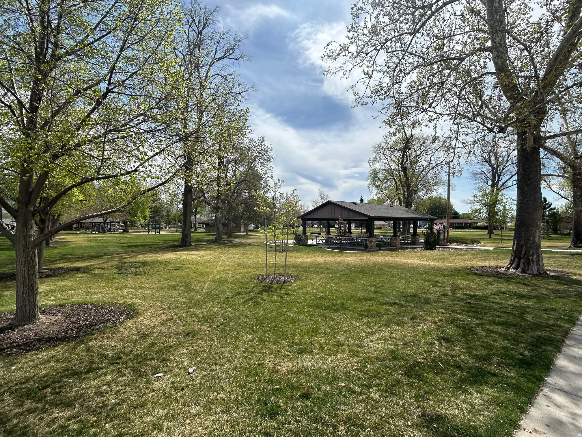 Wines Park - 1 block away. Expansive green space featuring 4 covered pavilions, mature trees, manicured lawn, and paved walkways