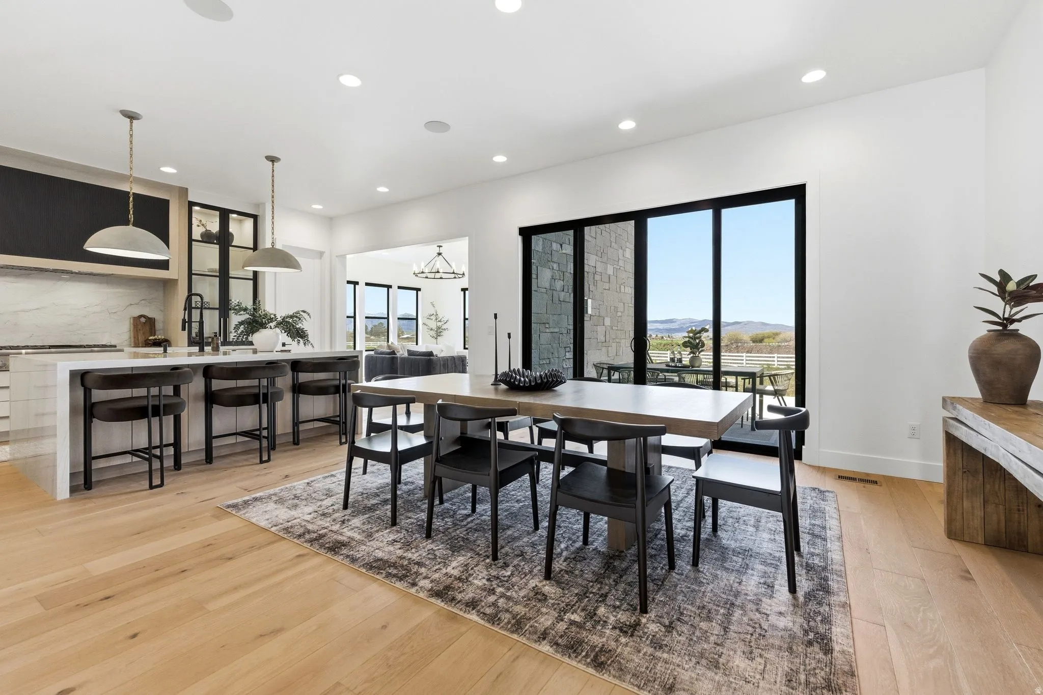 Open-concept living space with light wood-finish flooring