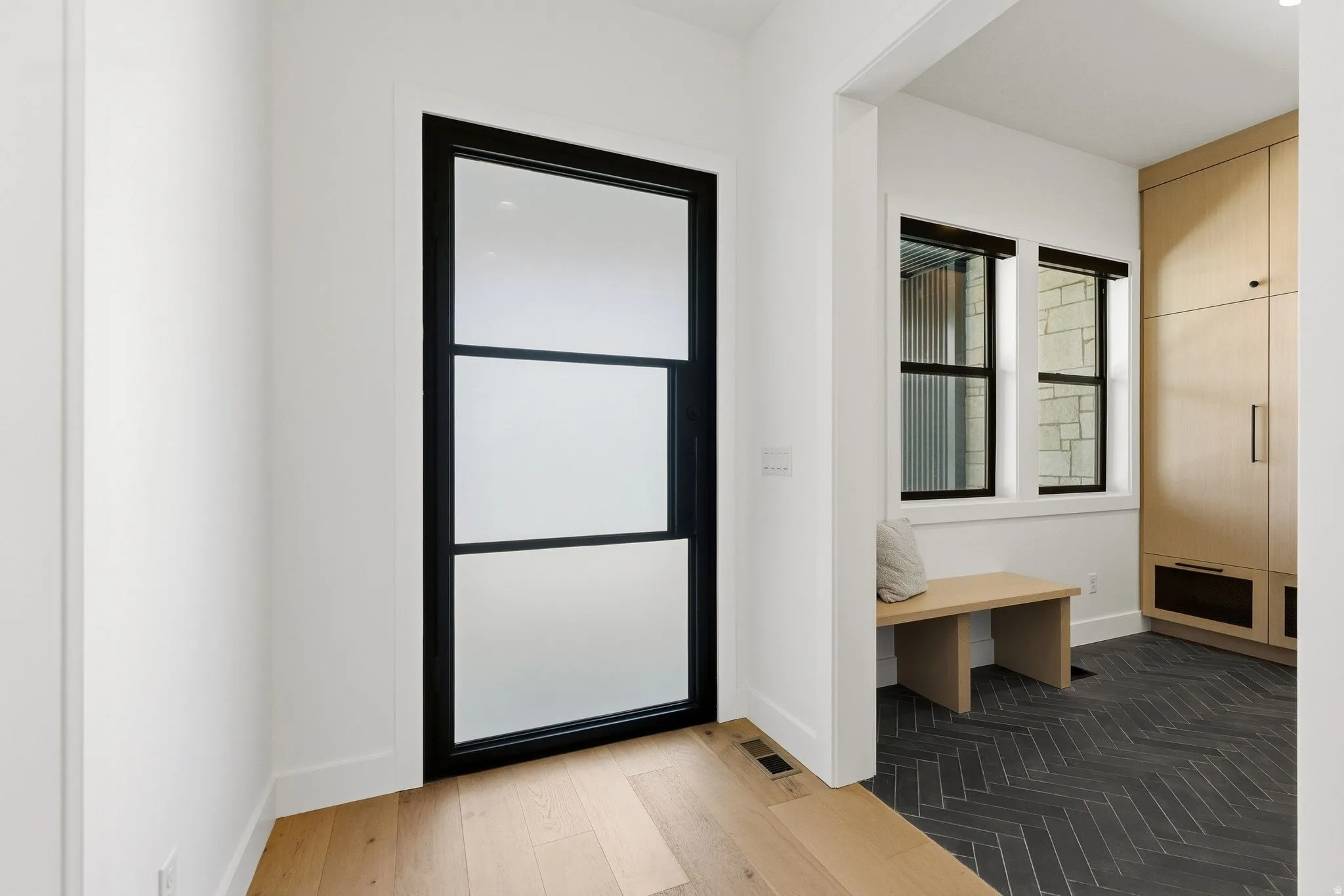 Black-framed door with frosted glass panels