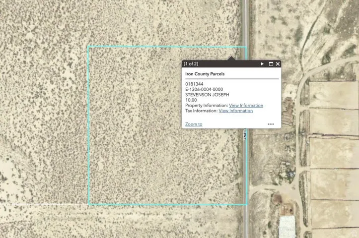 Aerial view showcasing a rectangular parcel of undeveloped land