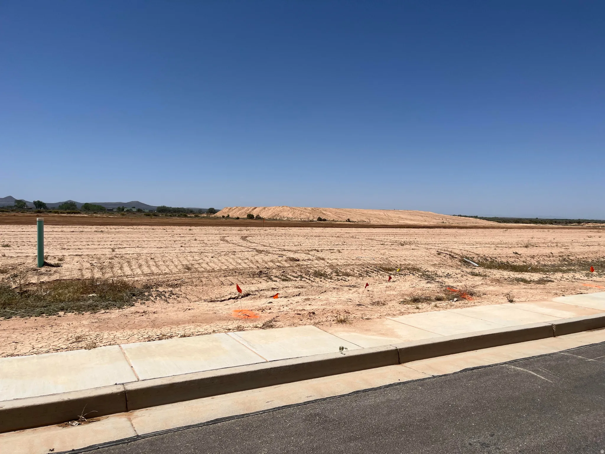 Expansive, level lot with clear skies, offering a substantial building area