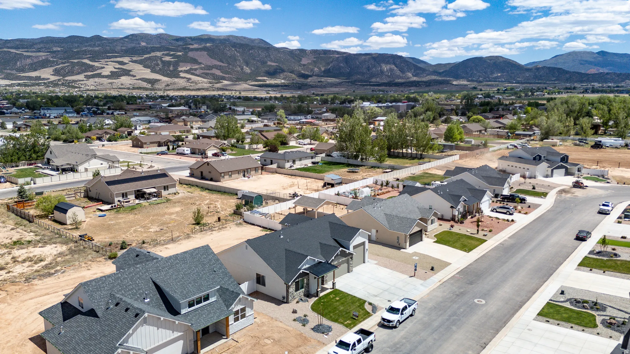 Aerial perspective showcasing a residential street with multiple contemporary homes