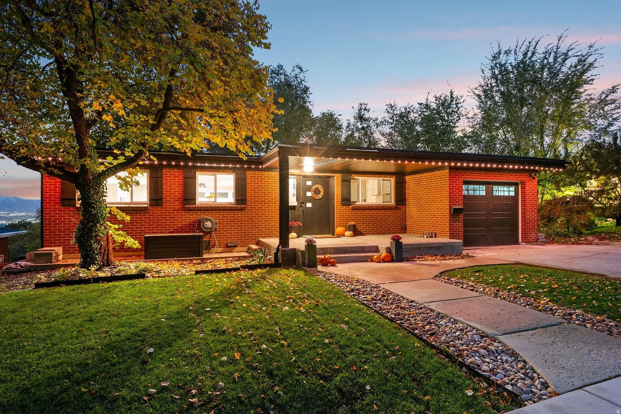 Red brick exterior featuring a covered entry porch
