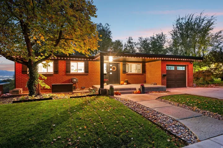 Red brick exterior featuring a covered entry porch
