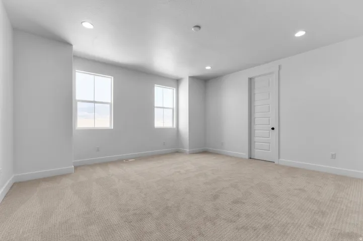 Bright, open room flooded with natural light through dual windows