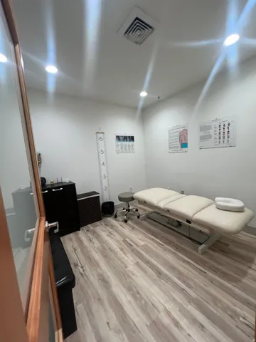 Interior room with wood-finish flooring, recessed ceiling lighting, and a square ceiling vent