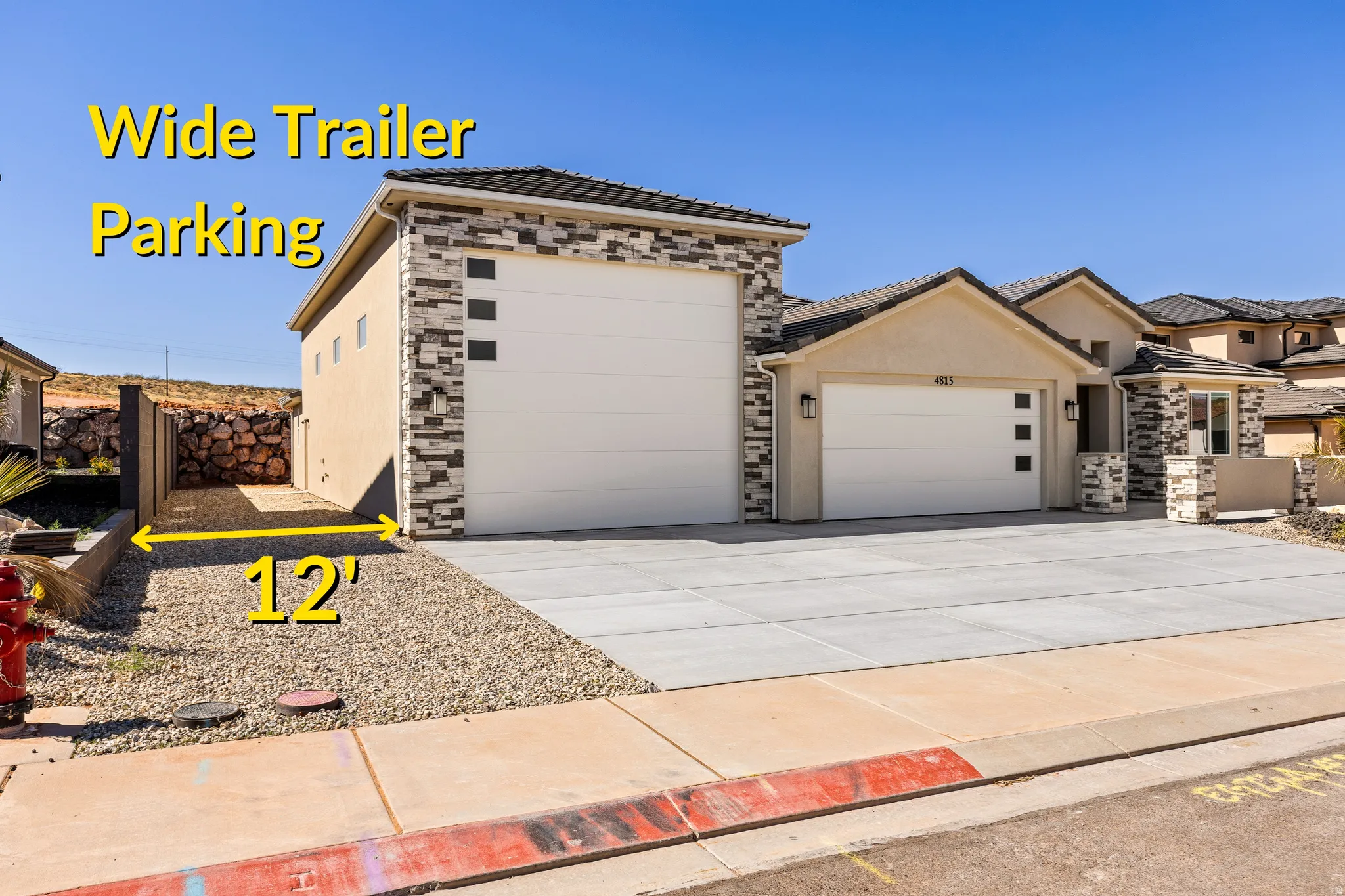 Contemporary exterior featuring stucco and stone veneer accents