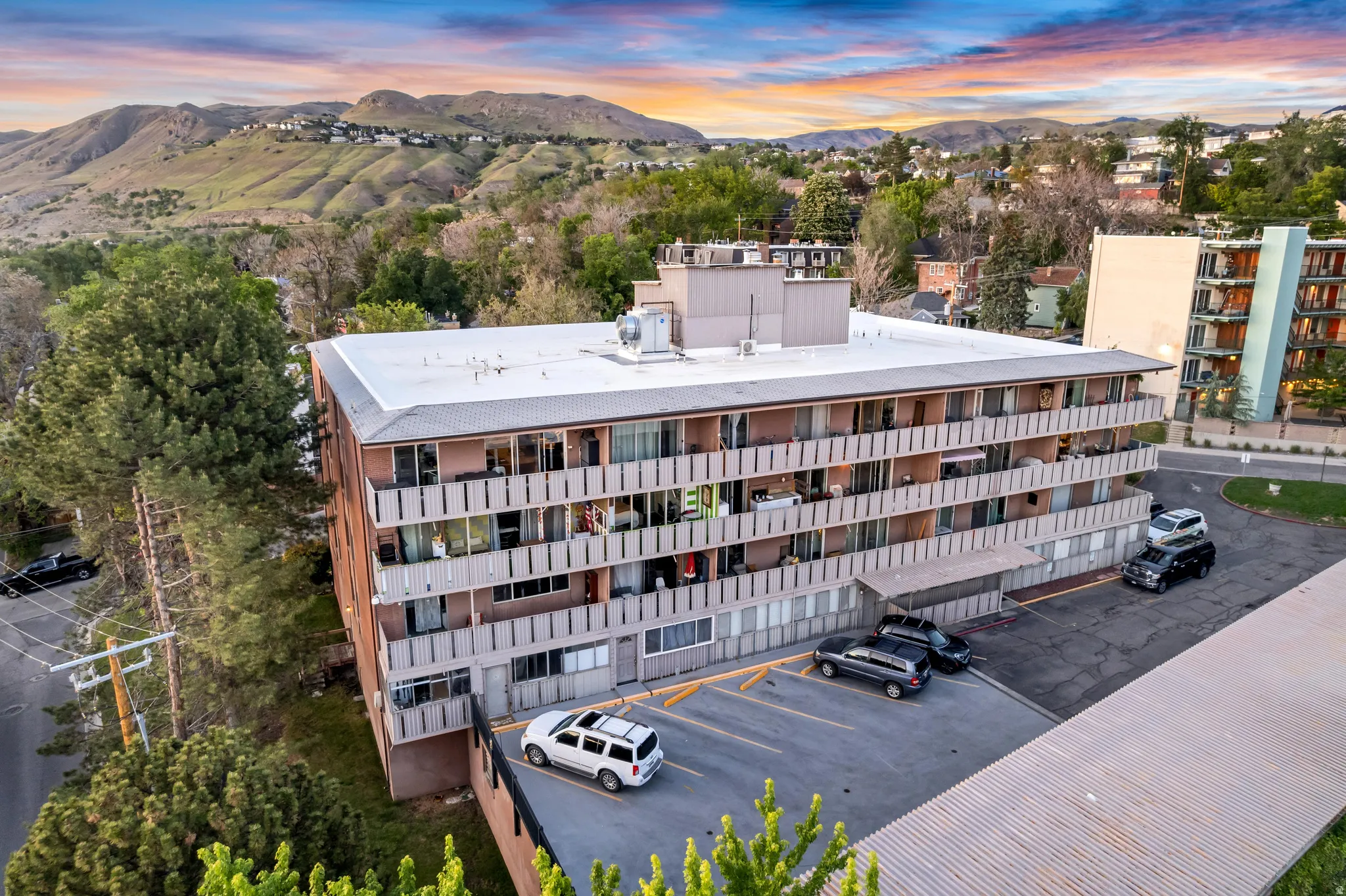 Multi-story building featuring brick and panel facades